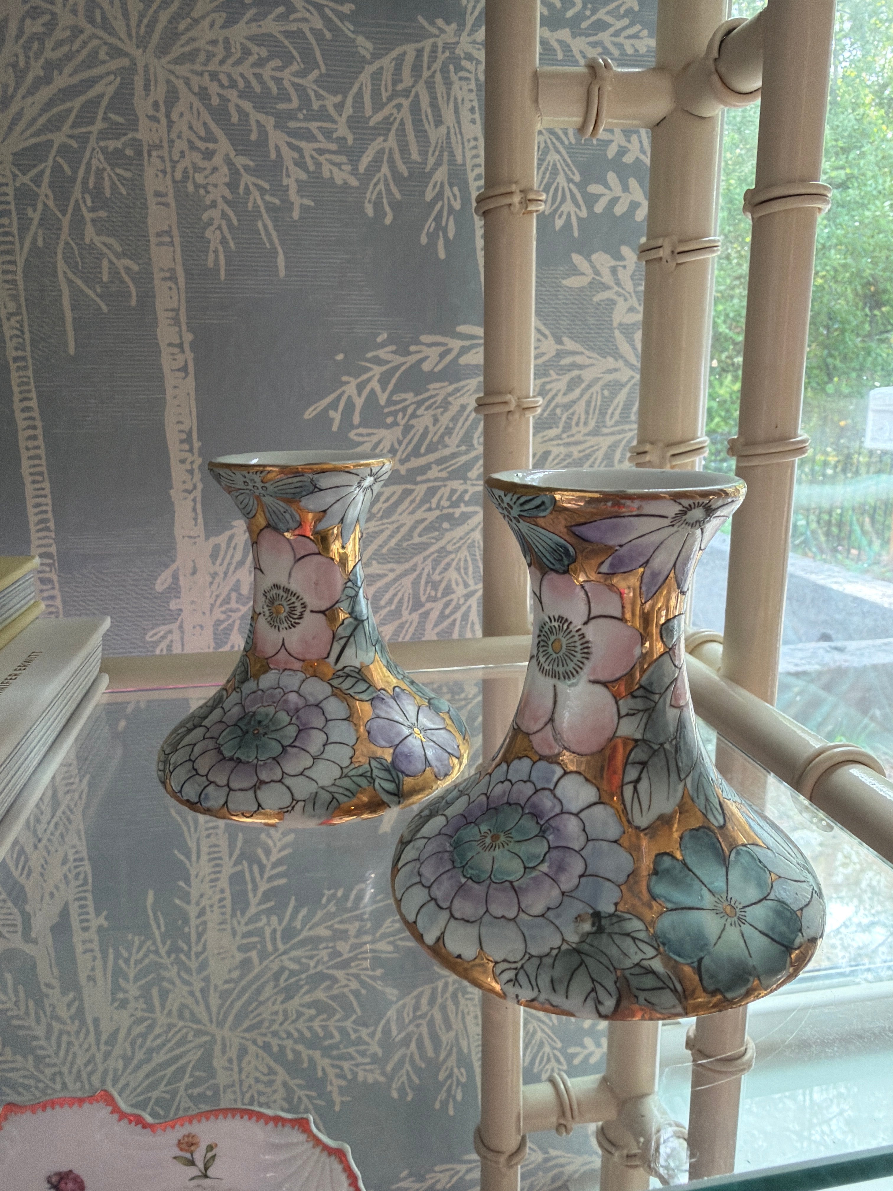 Vintage pair of porcelain candle holders with floral and gold decoration